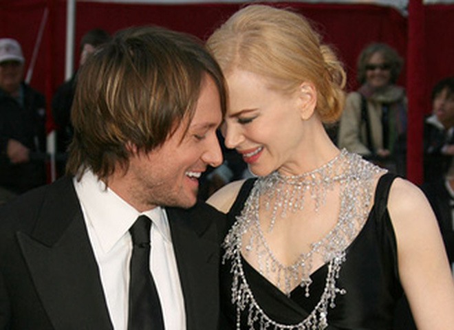 Николь Кидман и Кит Урбан с ребенком