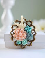 Як носити брошки