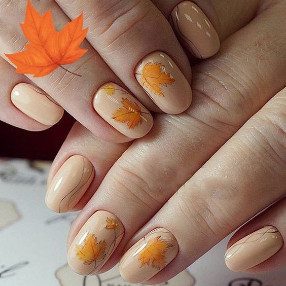 Модний тематичний манікюр на осінь з листочками
